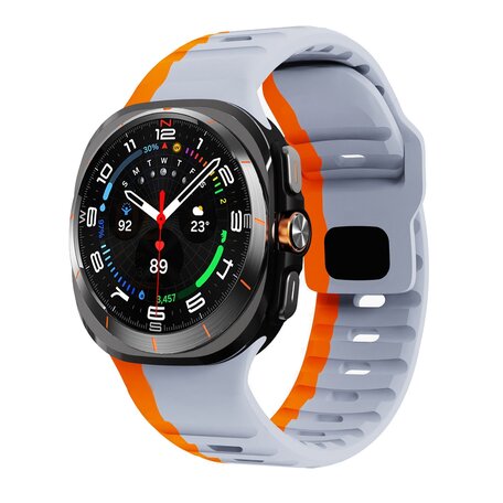 Wave siliconen bandje - Grijs met oranje - Samsung Galaxy Watch Ultra 47mm